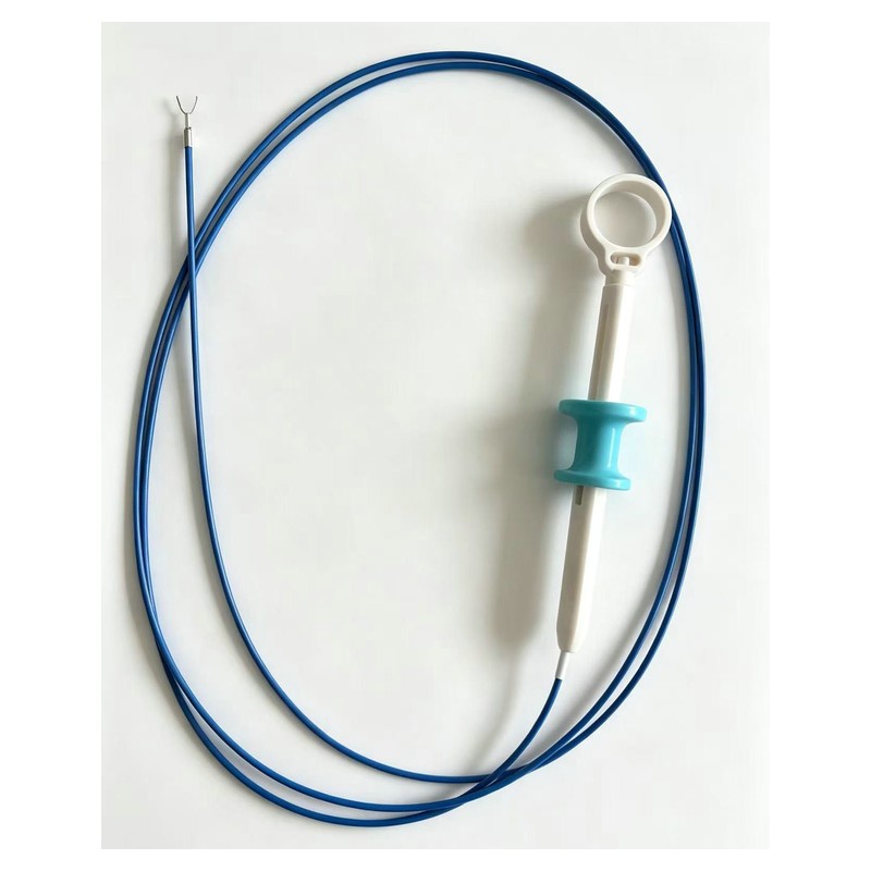 Full hemoclip device — blue coiled sheath with thumb-ring handle and distal clip